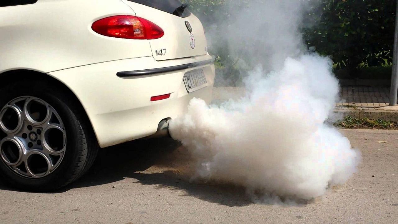 White Smoke Coming Car’s Exhaust Tip In Car